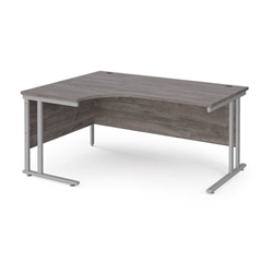 Maestro 25 left hand ergonomic desk 1600mm wide - silver cantilever leg frame, grey oak top