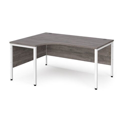 Maestro 25 left hand ergonomic desk 1600mm wide - white bench leg frame, grey oak top